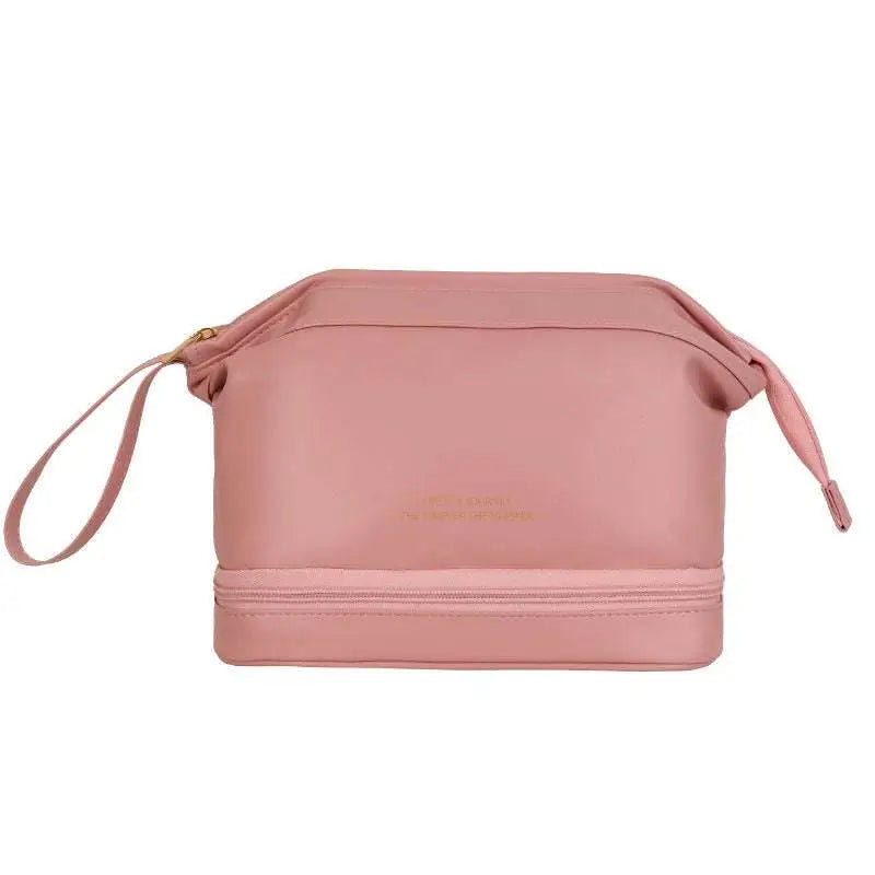 Blush pink large capacity travel cosmetic bag with two compartments gold-toned zipper and wrist strap makeup bag