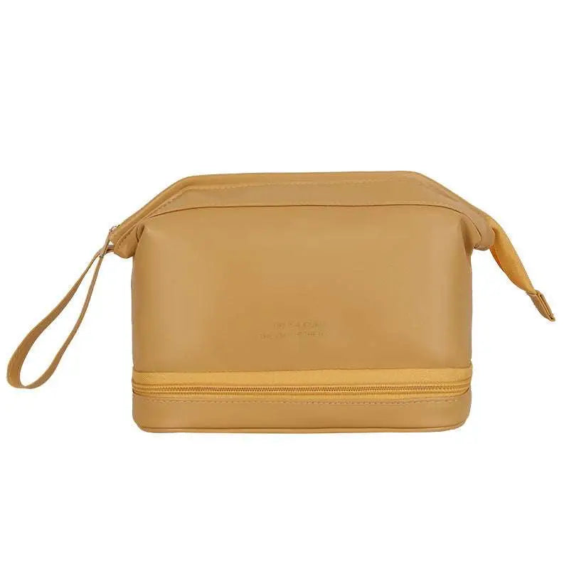 Tan two-compartment toiletry bag with wrist strap and zipper closure designed for blush pink large travel cosmetic bag use