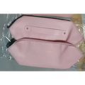 Blush pink large travel cosmetic bag with hexagonal shape gold-tone zipper and detailed stitching makeup bag