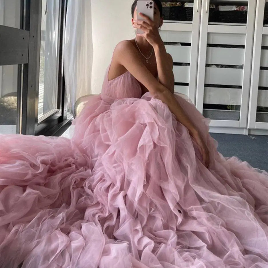 A blush pink mesh long dress evening gown prom with flowing tulle and delicate spaghetti straps for gown prom events