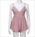 A delicate blush pink romper image featuring lace fabric and thin spaghetti straps in luxury women’s fashion