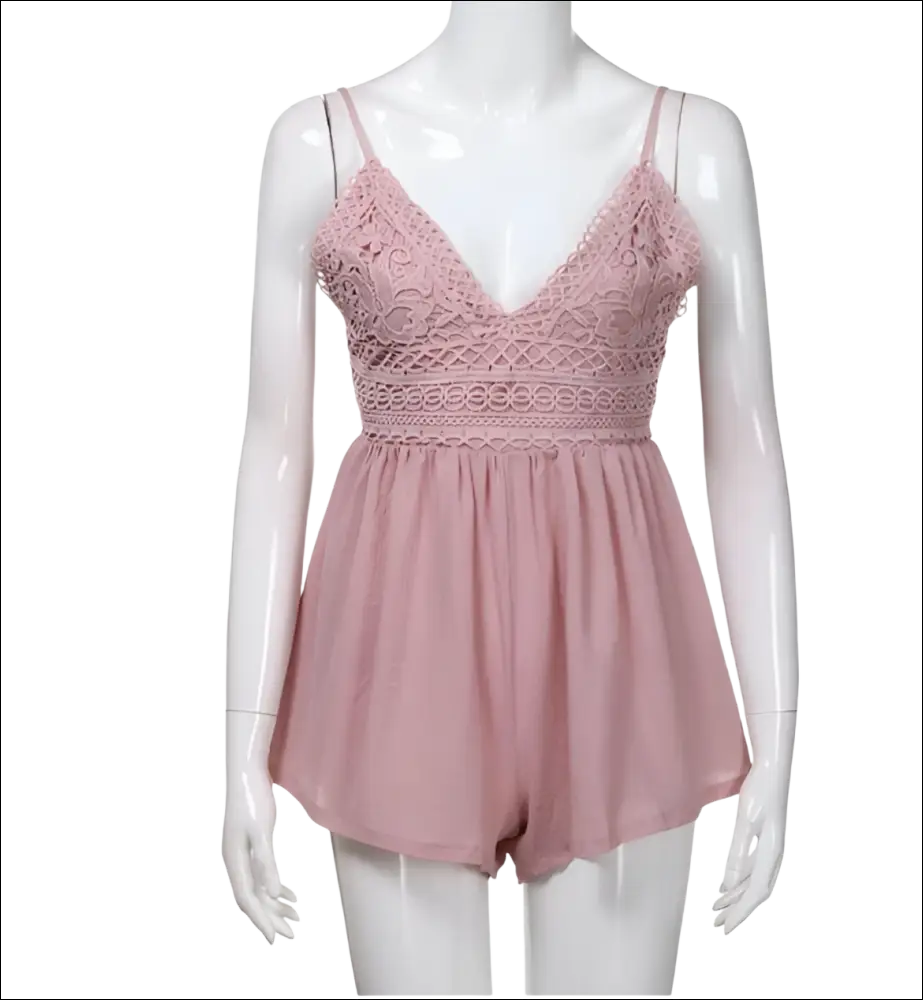 A delicate blush pink romper image featuring lace fabric and thin spaghetti straps in luxury women’s fashion