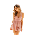 Blush pink romper image featuring soft lace and chiffon with v-neckline delicate straps and a flared skirt for luxury women’s fashion