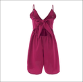 Blush pink romper image featuring vibrant magenta fabric with delicate lace trim and a matching front bow in luxury women’s fashion