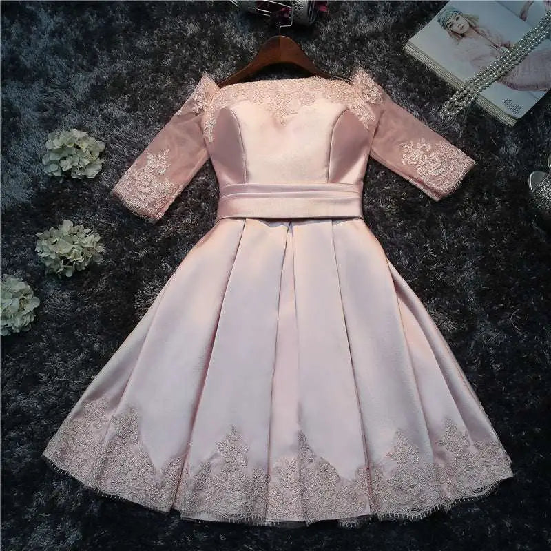 Blush satin lace evening dress featuring lace trim sleeves and hem with fitted bodice for bride wedding toast events