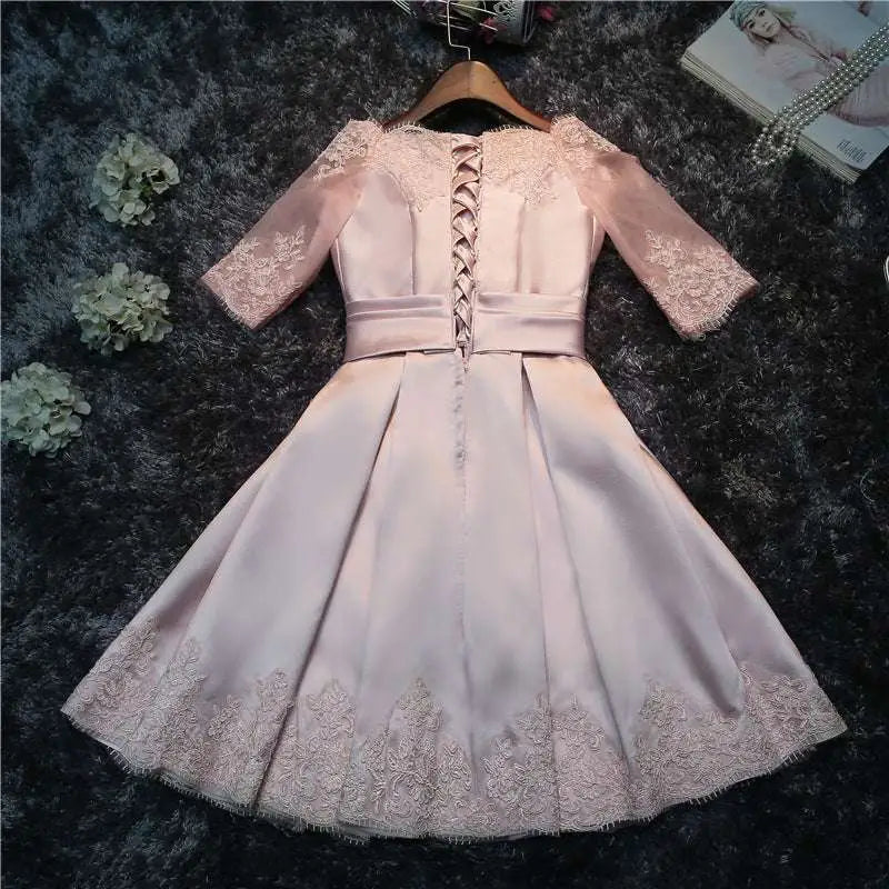 Blush satin lace evening dress with lace sleeves bodice and hemline fitted waistband for bride wedding toast events