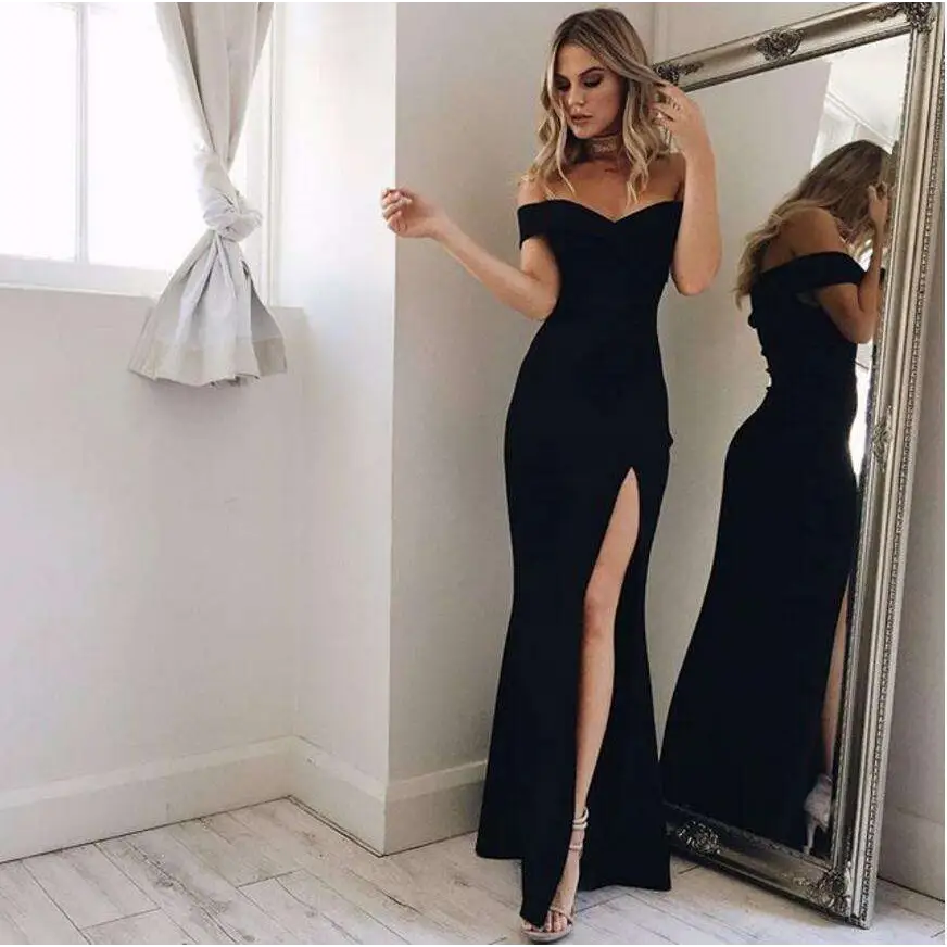 A sleek black off-the-shoulder blush satin luxury fashion tube dress with a high slit and fitted mermaid silhouette