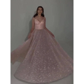 A shimmering blush pink sequined backless evening dress with fitted bodice and voluminous glitter-dusted skirt