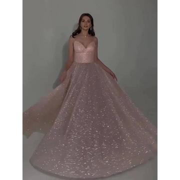 A shimmering blush pink sequined backless evening dress with fitted bodice and voluminous glitter-dusted skirt
