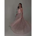A blush pink sequined backless evening dress with a fitted bodice and flowing tulle skirt for formal occasions