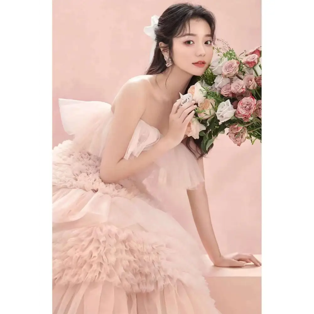 A blush pink photography pettiskirt colored mesh dress with multi-tiered ruffled layers and a sweetheart neckline