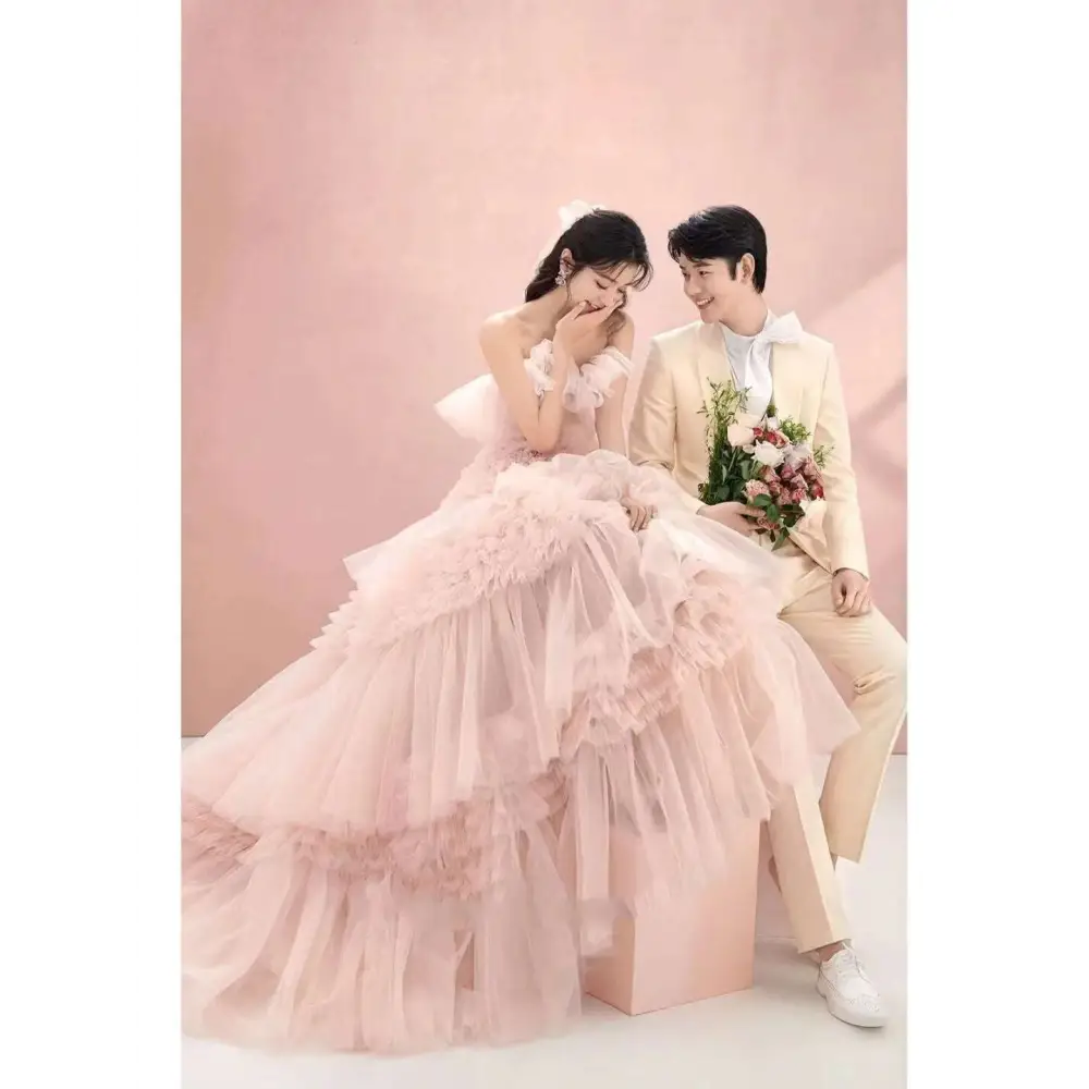 A blush tiered photography pettiskirt colored mesh dress with voluminous pink layers and a sweetheart neckline