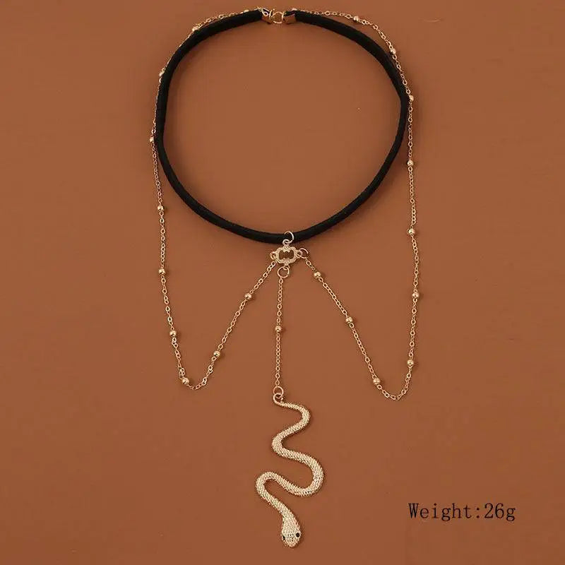 Black velvet choker necklace with gold-toned bohemian boho gold snake pendant and beaded leg chain jewelry
