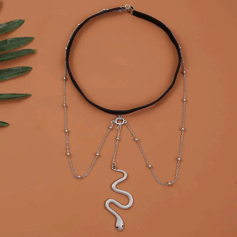 Black choker necklace with silver snake pendant and beaded chains in bohemian boho gold snake leg chain jewelry style