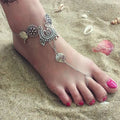 Silver-toned bohemian jewelry antique flower foot chain featuring intricate floral paisley designs with shell-like charms