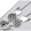 Silver-toned bohemian jewelry antique flower foot chain featuring intricate floral and circular pendant designs with chain