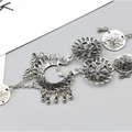 Silver-toned bohemian jewelry antique flower foot chain featuring intricate peacock filigree and dangling bead accents