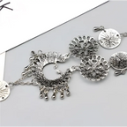 Silver-toned bohemian jewelry antique flower foot chain featuring intricate peacock filigree and dangling bead accents