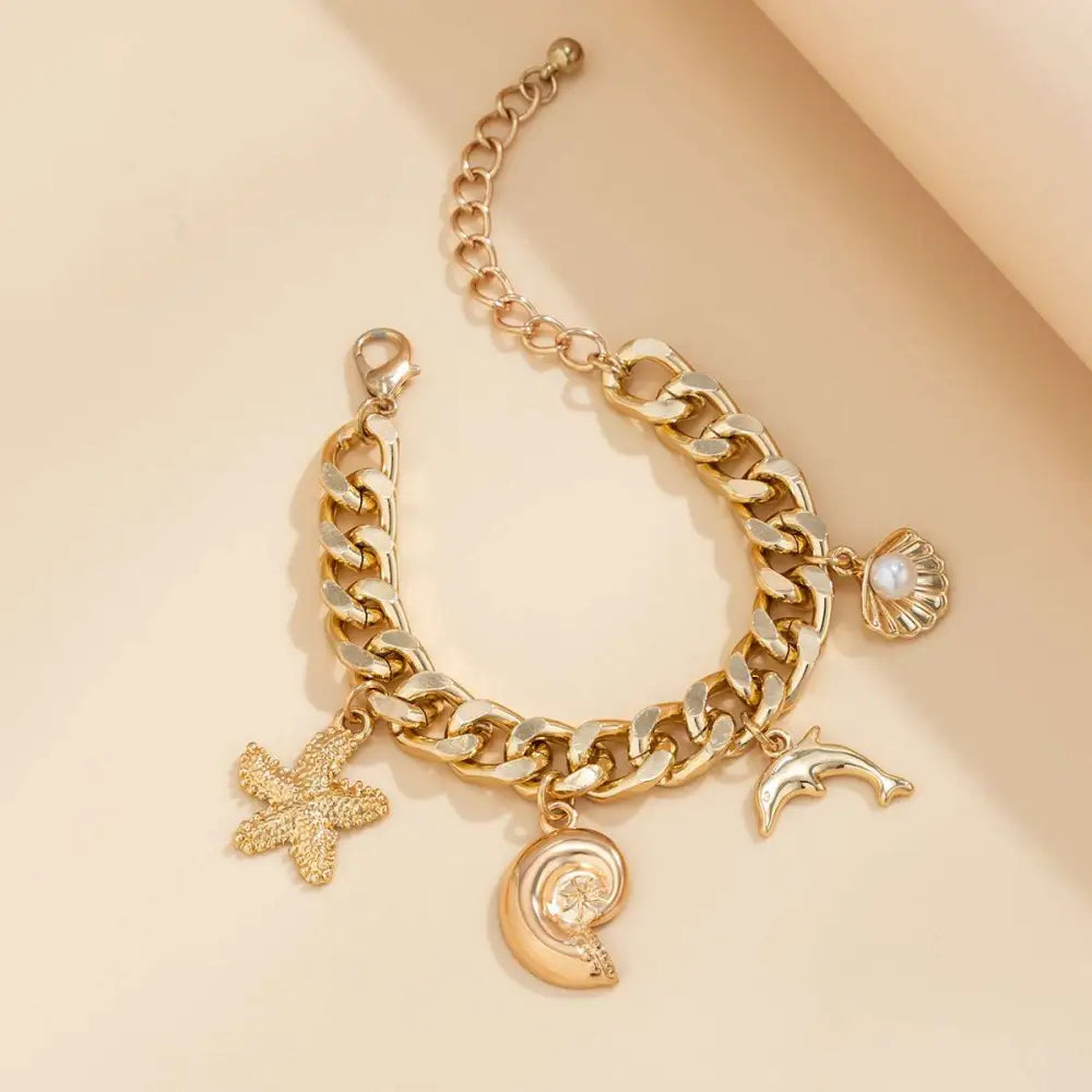 Gold-toned chunky chain bracelet with conch dolphin starfish charms from boho choker necklace bracelet set