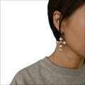 Gold-toned cross earrings adorned with round pearls ideal for luxury women’s fashion accessories and plus size dresses bikinis