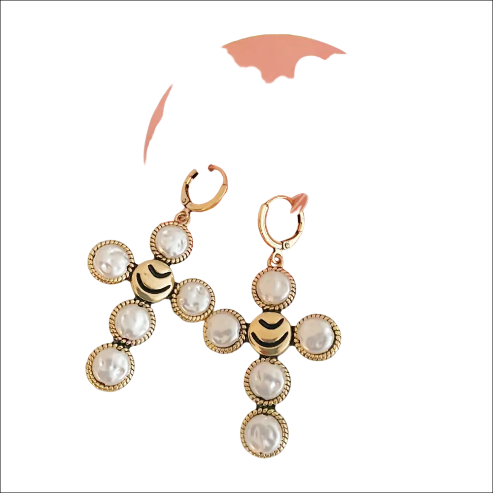 Gold-toned cross earrings with a smiling face and white pearls featuring intricate beaded detailing for luxury women’s fashion