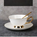 Elegant white bone china coffee cup with gold trim, sleek golden handle, and matching saucer afternoon tea set