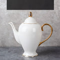 Elegant white bone china coffee pot with gold-trimmed lid handle and spout for saucer afternoon tea set