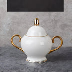 White ceramic sugar bowl with gold accents from elegant white bone china coffee cup and saucer afternoon tea set