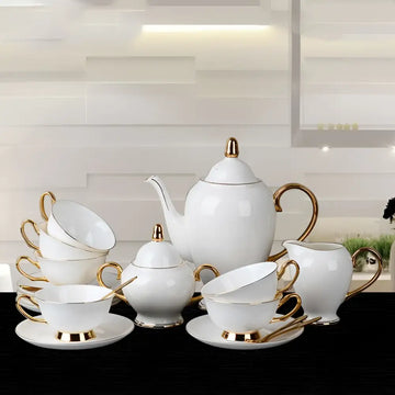 Elegant white bone china coffee cup and saucer afternoon tea set with gold accents and handles