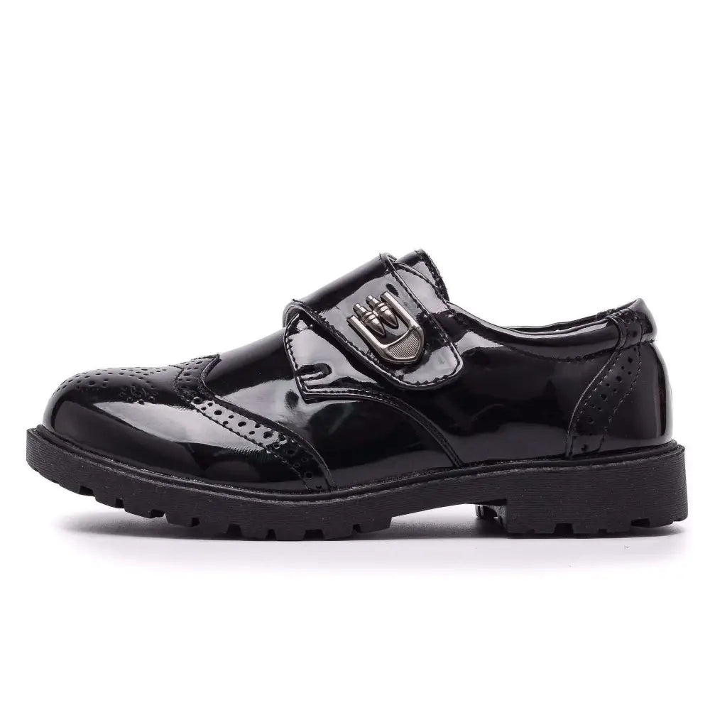Boys black patent leather shoes with brogue detail in british casual single style featuring sturdy rubber sole