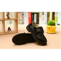 Boys black patent leather dress shoe with brogue detail and velcro strap in british casual single style