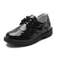 Boys black patent leather shoes with brogue detail in british casual single style featuring sturdy rubber sole