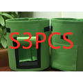 Green breathable potato tomato vegetable plant growth bags with black trim and rectangular front cutout for planting