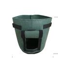 Green felt breathable potato tomato plant growth bag with black fabric straps and front rectangular opening