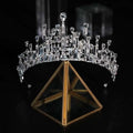 A sparkling silver bridal crown rhinestone tiara with clear faceted stones and intricate geometric baroque design