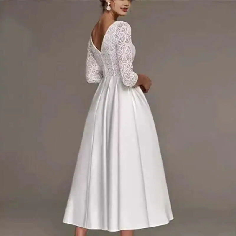 White lace bridal deep v-neck wedding dress with intricate floral patterns and three-quarter sleeve wedding dress design