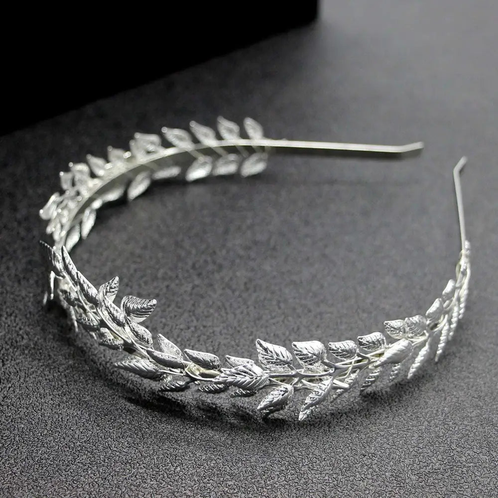 Bridal golden leaf headband featuring delicate silver alloy crown with intricately crafted metal leaves on slender frame
