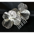 Silver floral bridal headdress with delicate wirework petals and pearl accent in a super fairy golden flower comb design