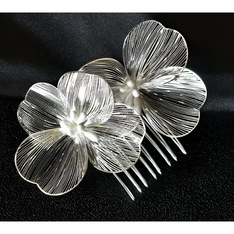 Silver floral bridal headdress with delicate wirework petals and pearl accent in a super fairy golden flower comb design