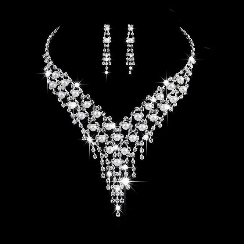 Bridal jewelry set featuring a sparkling silver pearl rhinestone necklace with cascading crystals and matching earrings