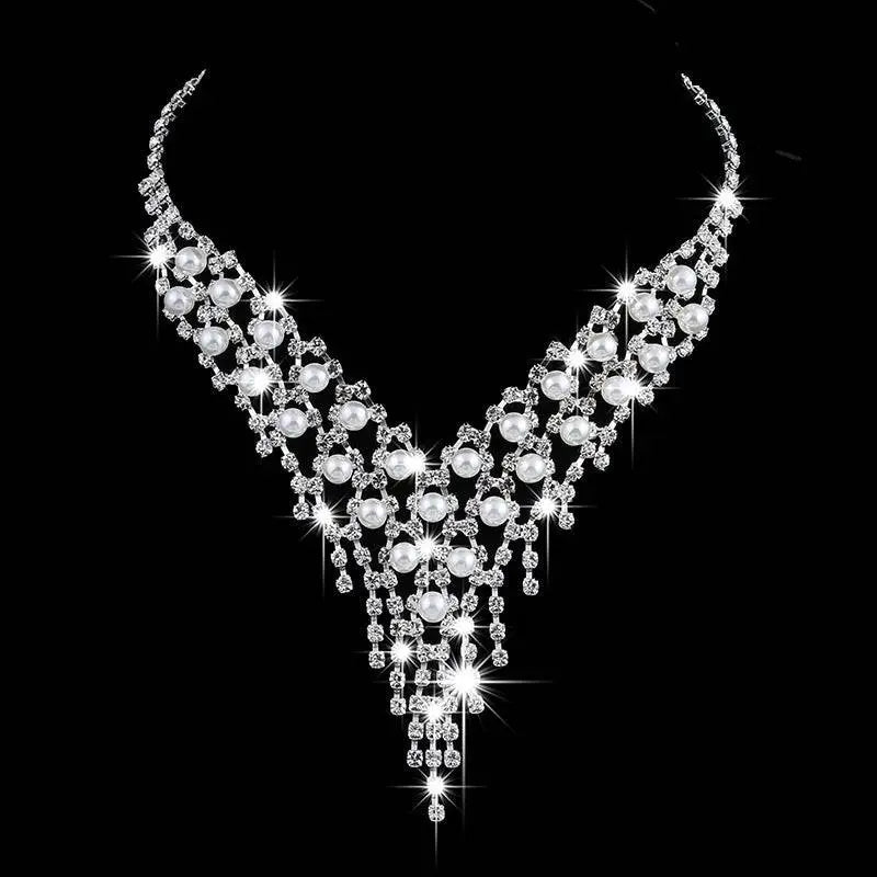 Bridal jewelry set featuring a sparkling silver v-neck pearl rhinestone necklace with cascading white pearls and crystals