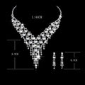 Bridal jewelry set featuring a sparkling silver pearl rhinestone necklace with a v-shaped cascading design