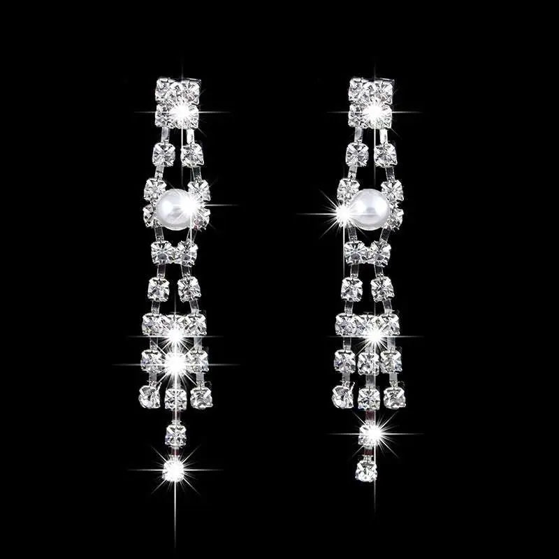 Bridal jewelry set featuring a sparkling silver pearl rhinestone necklace with cascading crystals and matching earrings