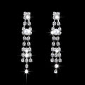 Sparkling crystal chandelier earrings with central pearl and cascading rhinestones from a bridal jewelry set with pearl rhinestone necklace