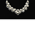 A delicate silver-toned bridal pearl necklace with cream pearls and sparkling rhinestone jewelry two sets design