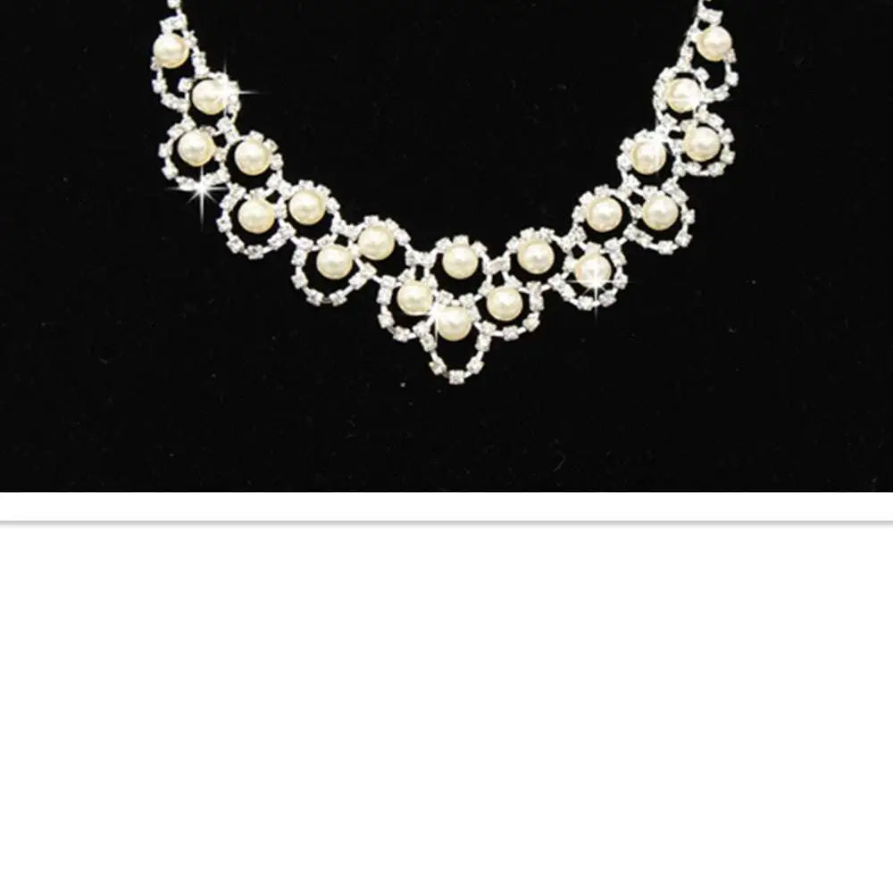 A delicate silver-toned bridal pearl necklace with cream pearls and sparkling rhinestone jewelry two sets design