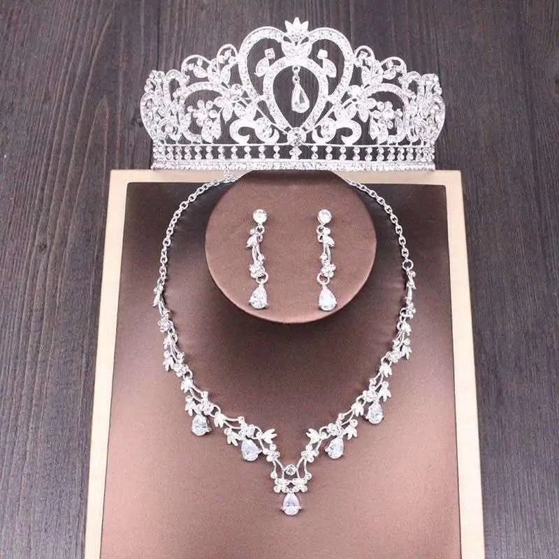 Silver bridal rhinestone crown necklace set featuring intricate floral patterns and sparkling crystals for weddings