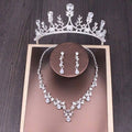 Silver bridal rhinestone crown featuring intricate floral clear crystals and delicate leaf motifs in crown necklace set
