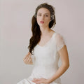 White lace bridal veil pearl featuring delicate beaded embellishments and a large hole mesh hair comb accessory
