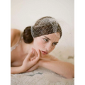 Delicate white bridal veil rhinestone large hole mesh headdress gently draping over the model’s head
